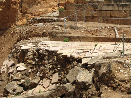Broken flooring at Caesarea Philippi that was destroyed in one of the earthquakes that altered the flow of the water that had previously come from the cave known as the "Gates of Hades."