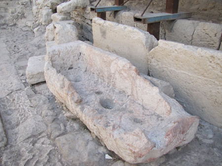 An ancient water trough at the Pool of Siloam. Notice the holes bored in the rock that were used to stabilize the water jugs as they were filled.