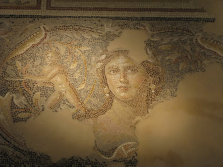 A detailed and beautiful mosaic of a woman on a floor in a dining foom in Sepphoris from about 200 AD