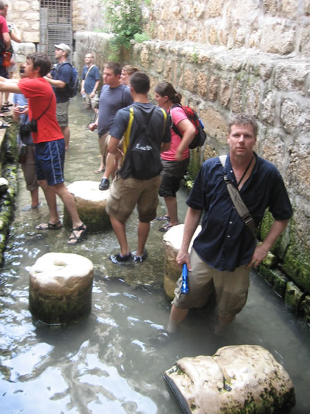 Galyn in the water at the end of Hezekiah's tunnel.  This channel of water was formerly thought to be the Pool of Siloam.  In 2004 large stone steps further down the water flow were found. By 2005 the new site for the original Pool of Siloam had clearly been discovered