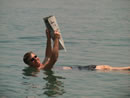 Galyn floating in the Dead Sea Reading the Des Moines Register