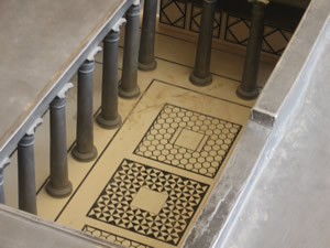 Model of one of Herod's steam rooms in his bath house on Masada. Notice the mosaic floors and the fresco walls.