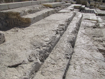 The original steps from the days of the New Testament used to access the Temple Mount from the south. These steps were designed to create a slow procession up the to the Temple Mount by alternating a wide step (long run, 35 inches) with narrow step (short run, 12 inches) as seen in this photo.
