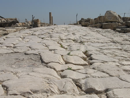 An ancient Roman road in Sepphoris. Notice the goove cut in the pavement stone by the wagon wheels. (More details on Sepphoris here.)