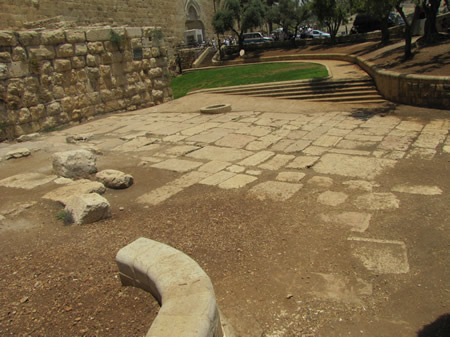 Roman (Byzantine) pavement from 135 AD is seen outside the south wall of the Old City of Jerusalem's south wall. The Dung Gate can be seen in the background. 