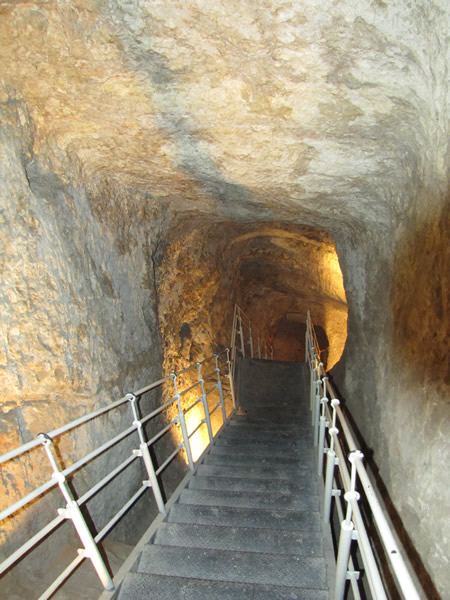 Descending a shaft cut in rock to access the Gihon Springs.