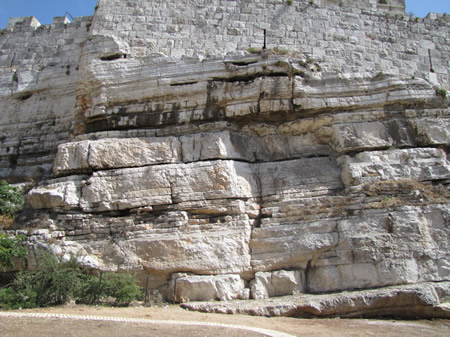 Bedrock of Mount Moriah on the north side of the Old City Jerusalem. This bedrock has been part of the city walls since Bible times. Even today the north walls of Jerusalem set at the top of this bedrock from Mount Moriah. 