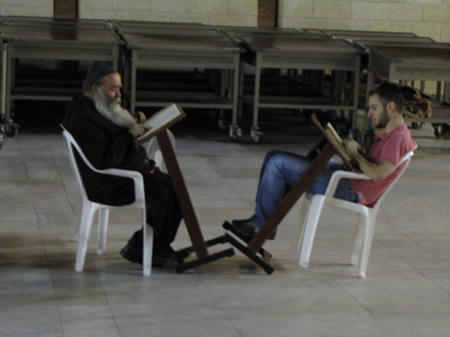 Studying at the Western Wall late at night in June. 