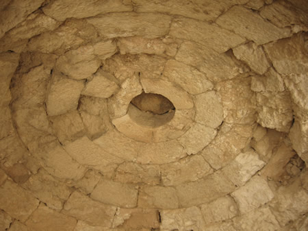 This domed, hewn-stone ceiling with an oculus (circular opening in the top) in one of Herod's warm baths on the Herodion is the oldest orbed ceiling fouind in Israel. Herodian.