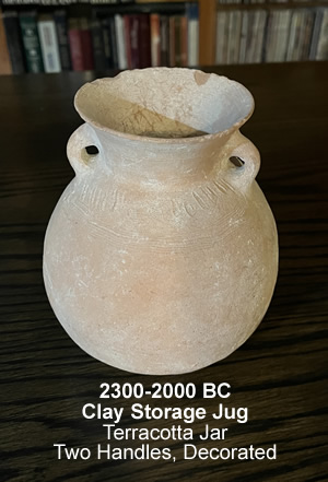 2300-2000 BC, A clay storage Jug, a decorated Terracotta Jar