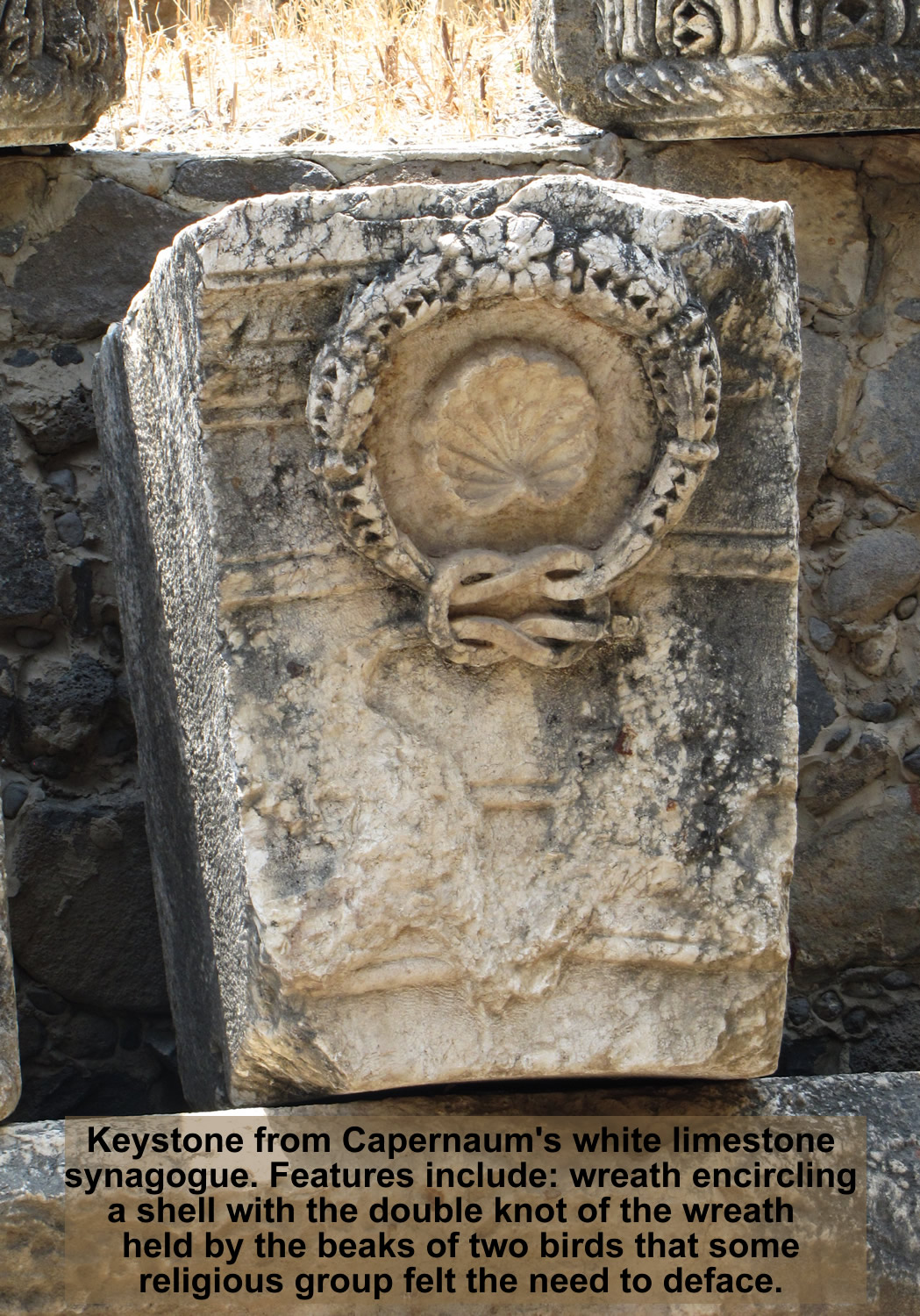 Keystone from white limestone synagogue in Capernaum