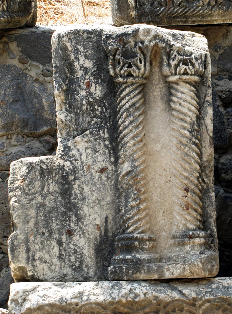 Engraved pillars in white limestone