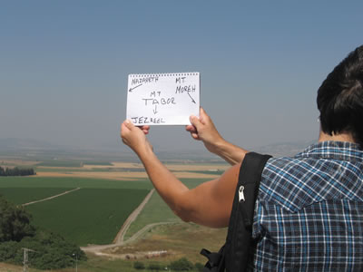 Toni standing on the hill called megiddo (Hebrew: "Har" means "hill" so the "Hill of Megiddo" would be "Har Megiddo" and without the rough breathing the "h" Har Megiddo is in English "ar megiddo" or "armegiddo" as in "armageddon"